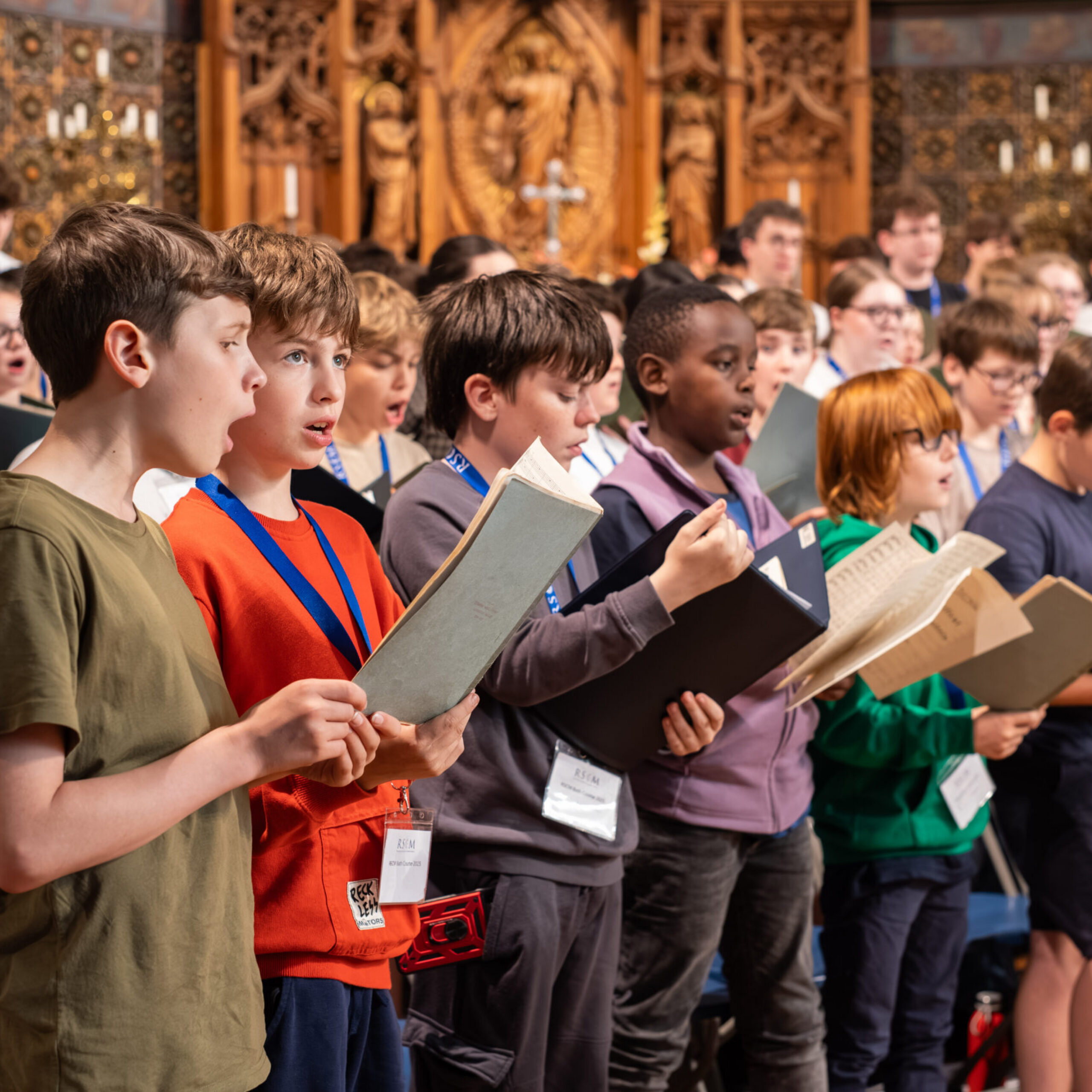 Young choristers singing in a parish church as part of the RSCM Choir Project funded by the Church of England